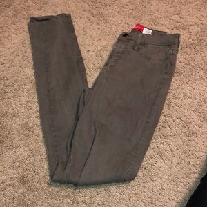 Distressed olive jeans